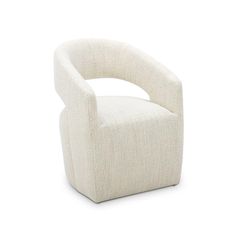 a white chair sitting on top of a white floor