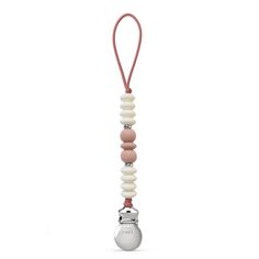 a white and pink pacifier hanging from a cord