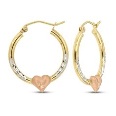 These beautiful hoop earrings for her are crafted in 14K yellow gold and feature 14K white gold diamond cut finishes. At the base of each, a pretty 14K rose gold heart finishes the look. The 20mm earrings secure with snap-lock clasps. 20mm Earrings, Snap Lock, Rose Gold Heart, Accessories Jewelry Earrings, Gold Heart, Heart Of Gold, Diamond Cut, Heart Earrings, White Gold Diamonds