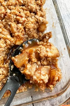 a glass casserole dish filled with apple crisp