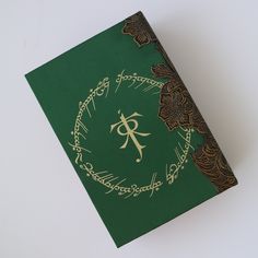 a green book with gold lettering on it