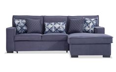 a blue couch with pillows on it