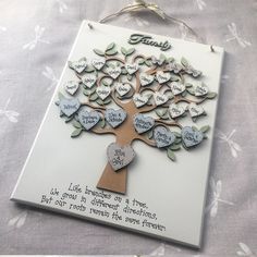 a family tree with hearts hanging from it's sides on a sheet of paper