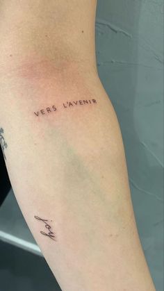 a woman's arm with the words verbo lavenia written on it