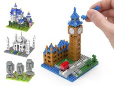 a hand holding a lego model of a castle and clock tower in front of it