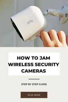 a hand holding a camera with the text how to jam wireless security cameras