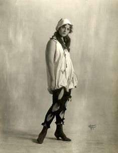 black and white photograph of a woman wearing boots