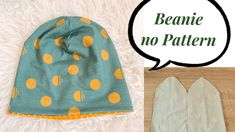 a beanie hat with yellow polka dots on it