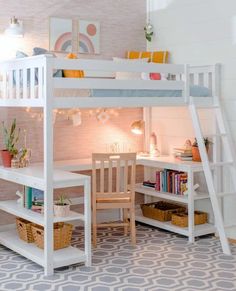 a white loft bed with desk underneath it