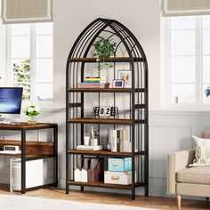 a living room with a computer on top of a book shelf