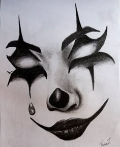 a drawing of a clown's face with teeth and nose piercings on it