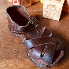 "Adorable vintage little boy's shoes Little brown leather strap sandals. Buckle closure No brand mark or size Measures approximately 5 7/8\" long and 2 5/8\" wide Well worn...vintage charm! Scrapes and scuffs. Vintage condition consistent with age and usage. Cute for a store or shop display, vintage child's room, or vintage vignette. Most of my items are previously owned, used, and loved. These items are rarely in perfect condition and are sold \"as is\". While I do my best to describe each item Vintage Open Toe Sandals With Buckle, Vintage Open Toe Sandals With Buckle Closure, Vintage Closed Toe Sandals For Beach, Vintage Closed Toe Beach Sandals, Vintage Beach Sandals With Buckle Closure, Vintage Brown Closed Toe Sandals, Vintage Brown Sandals With Round Toe, Vintage Closed Toe Sandals, 1950s Boy