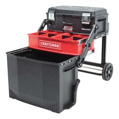 the craftsman's tool box is sitting on top of a cart with two tools in it