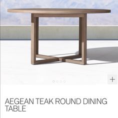 the table is made out of wood and has an oval shaped top with two intersecting legs