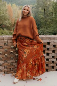 Get ready to fall in love with the Larina Midi Skirt! With its perfectly printed, billowy A-line silhouette, this skirt is an autumn essential you'll reach for again and again. Pair it with a basic tee and sneakers for a cozy coffee date or wrap up in a chunky knit for a trip to the pumpkin patch. *Chiffon - 100% Polyester*Smocked waist*Lined*58" waist to hem Fall Boho Outfits, Midi Skirt Outfit Fall, Boho Fall Outfits, Picture Frame Hangers, Denim Short Dresses, Cozy Coffee, Garden Harvest, Boho Fall, Fall Essentials