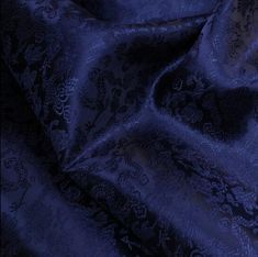 a close up view of a blue fabric with an intricate design on the bottom and sides