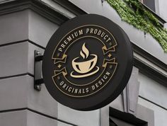 a black and gold sign on the side of a building that says premium product coffee