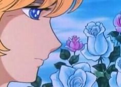 a girl with blonde hair and blue eyes looking at pink roses in front of her face