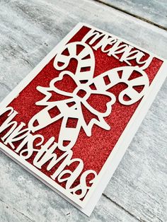 a red and white card with the words merry christmas on it