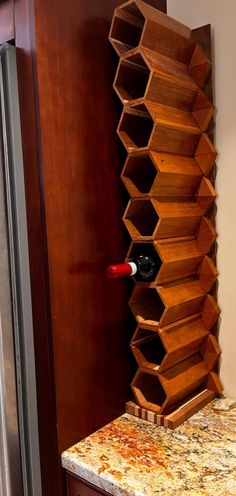 a wooden wine rack sitting on top of a counter