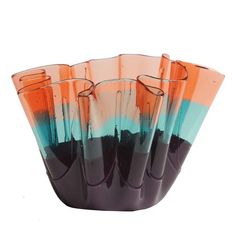 five orange and blue glass vases sitting on top of each other