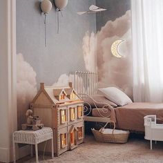 a bedroom with a doll house and swan decorations