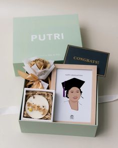 an open box with some cookies in it and a card that says putri