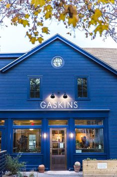 a blue building with the words gaskins on it's front door and windows