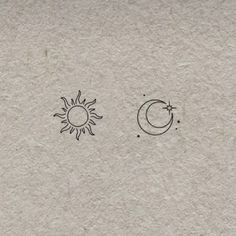 the sun and moon are drawn on paper