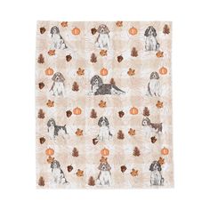 a scarf with dogs and pumpkins on the front, along with leaves and acorns