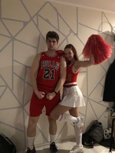 a man and woman dressed up as basketball players