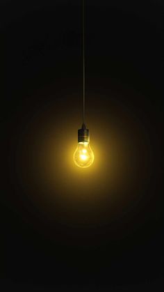 a light bulb that is lit up in the dark, with no one inside it