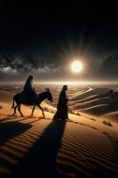 two people riding horses in the desert at night