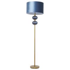 a floor lamp with a blue shade on it