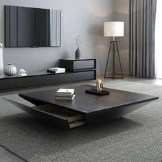 a living room with a coffee table and books