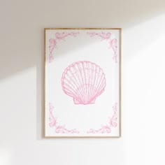 a pink sea shell on a white wall in a room with light coming through the window