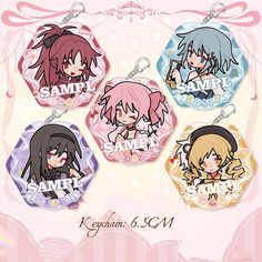 four keychains with anime characters on them, one is pink and the other is blue