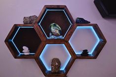 the shelves are made out of hexagonal wood and have blue lights on them