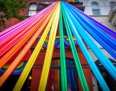 there is a building that has many different colored ribbons on it