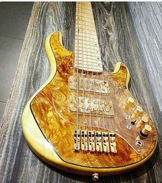 an electric guitar sitting on top of a wooden table