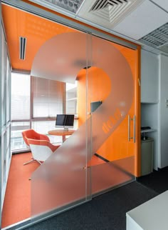 an office with orange and white accents