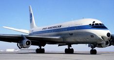 an american airlines plane is parked on the tarmac with it's wheels down