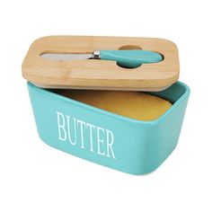 a blue butter container with a knife in it