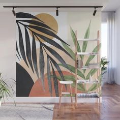 a wall mural with palm leaves and sunset in the background, on a wooden floor