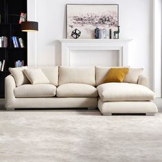 a living room with a large white sectional couch