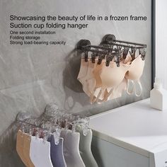 Description: Introducing the innovative Folding drying rack, a space-saving solution for your drying needs. This rack can be conveniently folded upward at 90 degree when not in use, making it ideal for home, balcony, dormitory, bathroom, wardrobe, bedroom, and more. Crafted from preferred thick material, this durable rack measures 26.6*9.5*11.4cm, providing ample space for your laundry items. The rack features a suction cup design, allowing for easy installation without the need for drilling hol Folding Socks, Folding Clothes Rack, Towel Clothes, Wall Mounted Drying Rack, Clip Hanger, Folding Hanger, Hanger Clips, Hanger Home, Clothes Drying