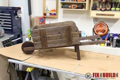 a wooden bench sitting on top of a workbench