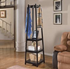 a living room with a chair and a coat rack