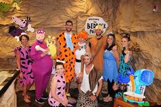 a group of people in costumes posing for a photo