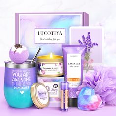 an assortment of personal care products displayed in front of a gift box on a table